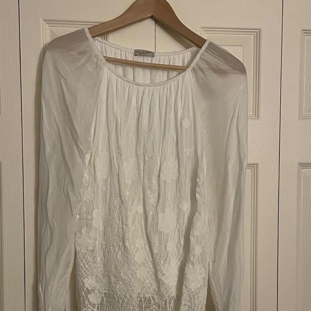Sheer sleeved top with embroidered front.